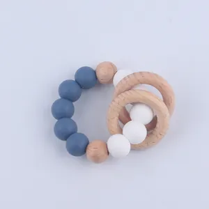 Close-up of silicone beads and beech wood rings for infant teething toy