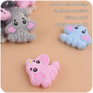 Macro detail of elephant-shaped soft silicone teethers for baby pacifier clips