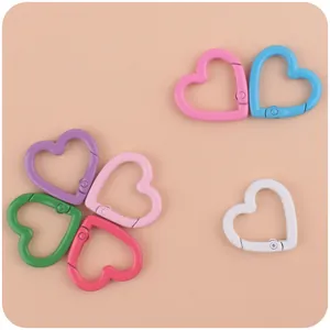Close-up of heart-shaped colorful paint metal spring rings for DIY keychain accessories