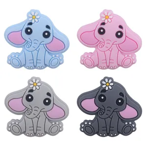 Detail of elephant-shaped silicone teethers in blue, pink, and grey colors