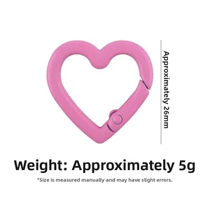Detail view of pink heart-shaped spring carabiner showing 26mm height and 5g weight