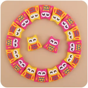 Detailed view of colorful owl silicone beads for DIY baby teething pacifier clips