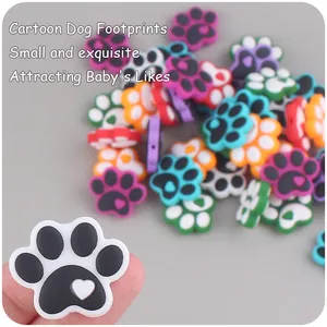 Detail of colorful silicone dog paw teether beads with heart cutout for DIY pacifier clips