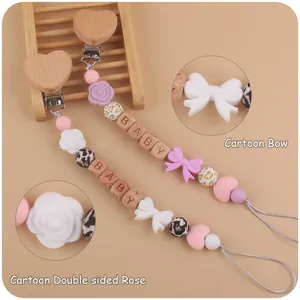Silicone pacifier chain with beech wood heart clip and cartoon bow rose beads