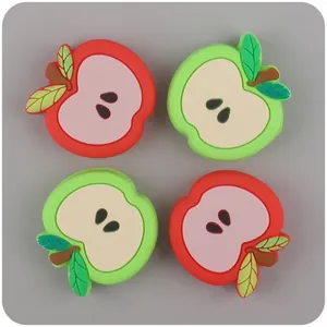 Set of four 3D silicone apple charms in red and green for baby accessories and shoes
