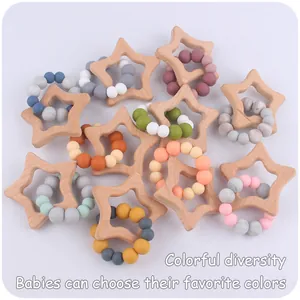 Detail of wooden star teether with colorful silicone beads for infant gum relief