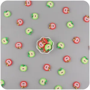 Detail of apple-shaped silicone beads for baby teether pacifier chains in red and green