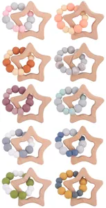 Detailed grid of star-shaped beech wood teether rings with colorful silicone beads