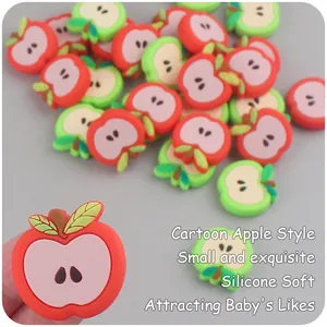 Macro detail of soft silicone apple-shaped teether charm for baby pacifier clips