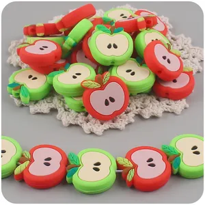 Detail of apple-shaped silicone beads with holes for DIY baby teething pacifier chains