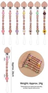 Detail view of beechwood baby pacifier clips and colorful silicone beads with size measurements