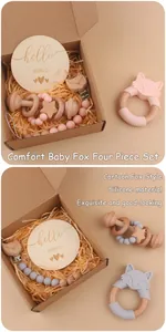 Detail of baby silicone fox teether set with beech wood rattle and milestone card