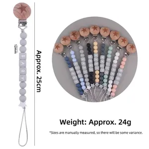 Attache-tétine en bois de hêtre et perles en silicone colorées avec motif étoile bébé
