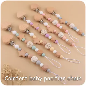 Multiple colorful macaron pacifier chains with heart clips and star beads details