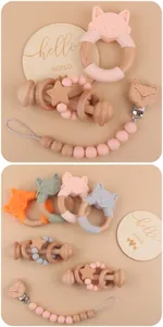 Detail view of fox silicone teether set with beech wood rattles and pacifier clip