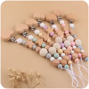 Handmade beech wood pacifier clip with crochet beads and stars in macaron colors