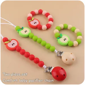 Detailed view of apple silicone pacifier clips and teething bracelets in two-piece sets