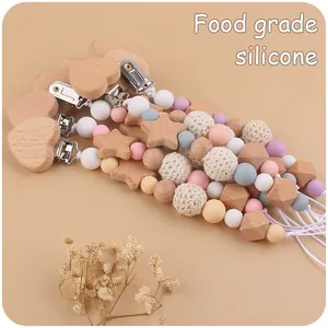 Detail of beech wood heart clip and food grade silicone beads for pacifier chain