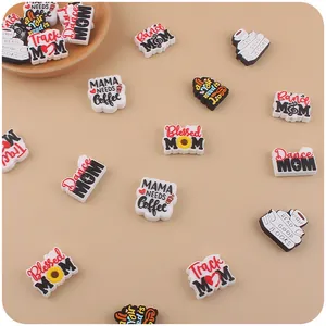 Detail view of Mom themed PVC shoe charms featuring coffee and floral patterns