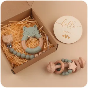 Baby silicone fox teether and beech wood rattle four-piece gift set in sage green