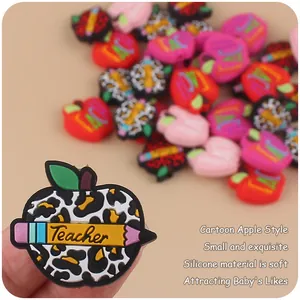 Detail of apple-shaped leopard print silicone beads with Teacher pencil design for DIY