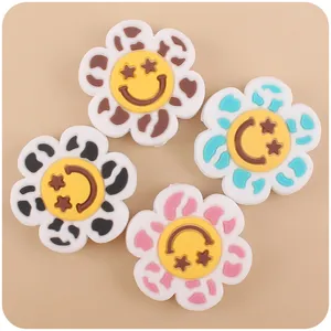 Detail of colorful cartoon flower silicone charms for baby teething pacifier clips