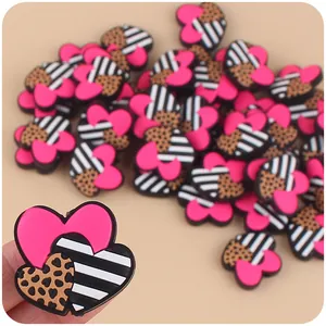 DIY baby teether accessory with pink heart, leopard print, and striped patterns