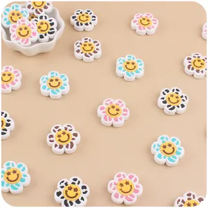 Macro view of flower silicone beads with smiley faces for DIY baby teething pacifier chains