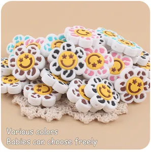 Detail of colorful smiley flower silicone beads for DIY baby pacifier clips and teethers
