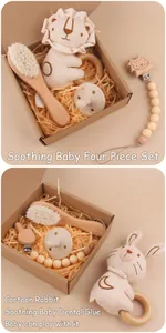 Soothing baby four piece gift set featuring lion rattle wood brush and pacifier chain