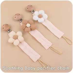 Three-piece set of pacifier clips with corduroy flowers and beech wood fasteners