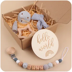 Baby gift set with star wooden teether, silicone pacifier, milestone card and bow headband