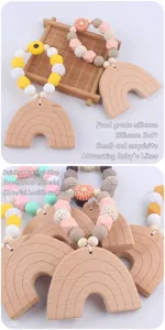 Detail of beech wood rainbow teether with food-grade silicone beads in macaron colors