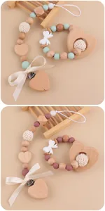 Detailed view of handmade pacifier clip set with wooden heart beads and knit bow