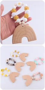 Detail of baby beech wood rainbow teether with colorful silicone and crochet beads