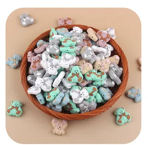 Detailed macro view of colorful cartoon bear silicone beads for DIY pacifier clips and teethers