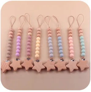 Attaches-tétines en silicone et bois de hêtre aux couleurs pastel avec clips en forme d'étoile