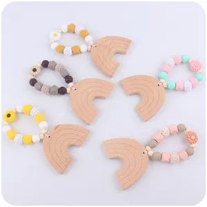 Rainbow beech wood teether rings with colorful silicone beads for infant sensory play