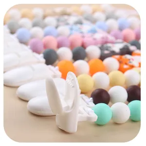 Detail of baby pacifier clip with cartoon cat silicone beads and safe plastic clasp