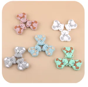 Macro shot of 5 colors of silicone bear beads for baby pacifier chain DIY accessories