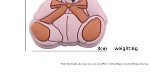 Detailed view of a 3cm pink cartoon bear silicone bead for DIY pacifier clips