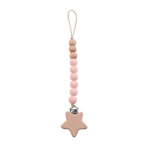 Attache-tétine étoile en bois de hêtre et silicone rose pour soulager bébé