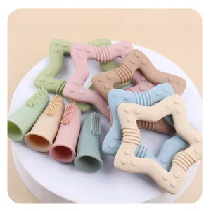 Infant star silicone teether and finger toothbrush set in soft Morandi colors