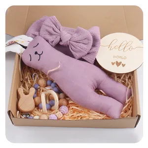 Purple bunny baby gift set with headband, wooden teether and pacifier clip in a kraft box