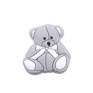 Close-up of a grey 3D silicone bear charm for baby pacifier clips or shoe decoration