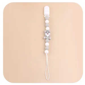 Detailed view of grey cat silicone pacifier clip with grey and white beads