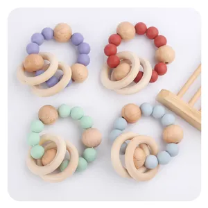 Baby silicone and beech wood teething ring sets in four colors with beads and rattle rings