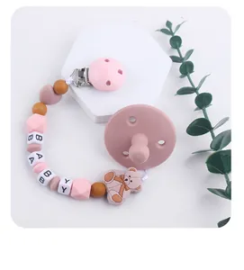 Detail of silicone pacifier clip with baby bear charm and morandi color beads
