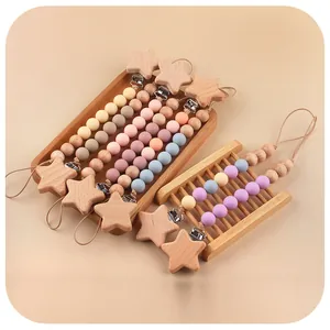 Attaches-tétines en bois de hêtre et silicone avec étoiles en couleurs Morandi