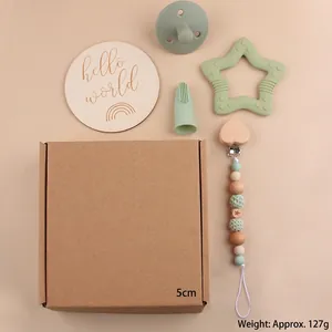Baby care gift set with star teether, pacifier, clip, and hello world wooden sign